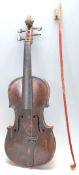 A 19th Century Victorian dark wood violin having  a hollow body with S shaped sound holes and