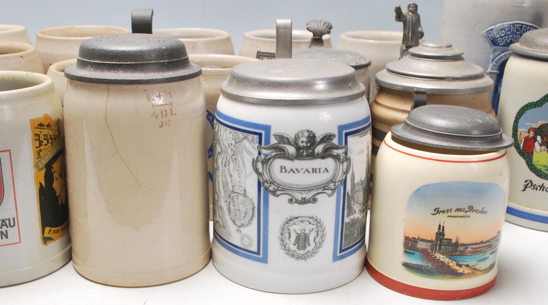 A large collection of 20th Century German blue and grey stoneware jugs and beer steins all having - Image 3 of 7