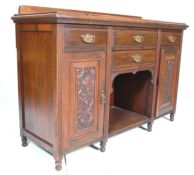 An antique Victorian 19th Century walnut credenza sideboard with 4 drawers having brass pulls over