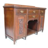 An antique Victorian 19th Century walnut credenza sideboard with 4 drawers having brass pulls over