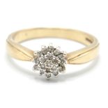 A hallmarked 9ct gold and diamond cluster ring having a cluster of round cut diamonds to the head