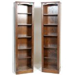A large pair of Jaycee / Old Charm Jacobean revival oak open 5 tier bookcases. Each bookcase  having