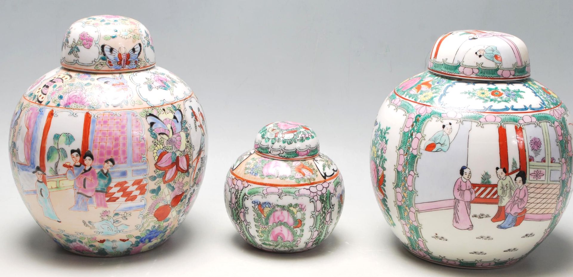 A group of three 20th Century canton ceramic famille rose ginger jars each having narrative panels