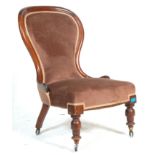 A 19th Century Victorian mahogany nursing chair / spoonback chair upholstered in chocolate brown