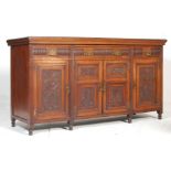 A 19th Century late Victorian oak sideboard dresser having a flared top over four drawers with brass