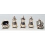 A set of 1930’s Adie Brother's silver condiments set to include three salt and paper shakers