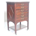 An Edwardian mahogany pedestal sheet music cabinet. The cabinet with six drawers having drop