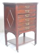 An Edwardian mahogany pedestal sheet music cabinet. The cabinet with six drawers having drop