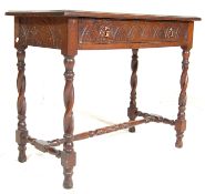 A late 19th century Victorian oak carved side writing table desk having a flared edge shaped top