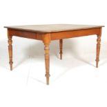 A 19th Century Victorian oak dining table of rectangular form having a stripped back tabletop over a