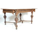 A 19th century Victorian French provincial oak extendable dining table. The table having cup and