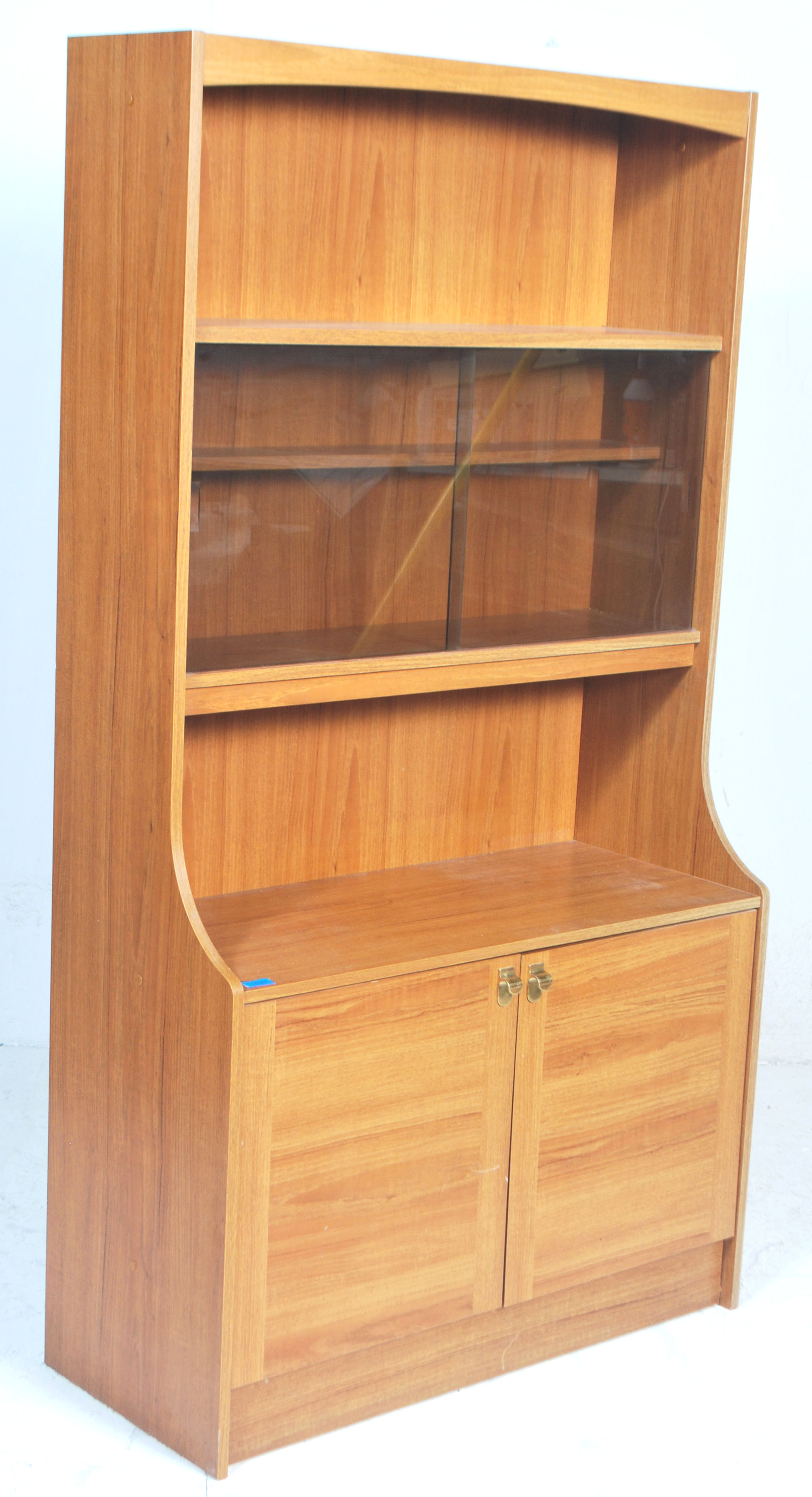 A retro 20th century teak wood veneer  room divider - bookcase cabinet. The upright body with