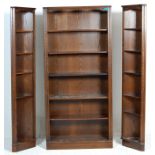 A large Jaycee / Old Charm  Jacobean revival oak triple bookcase cabinet having a central bookcase