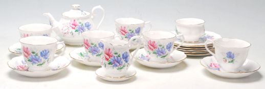 A Royal Albert tea service in the Friendship / Sweet Pea pattern comprising of 6 tea cups, saucers