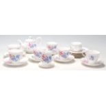 A Royal Albert tea service in the Friendship / Sweet Pea pattern comprising of 6 tea cups, saucers