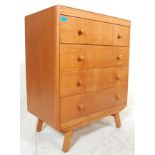 A vintage retro 1960's light / golden oak chest of drawers having a bank of four drawers having