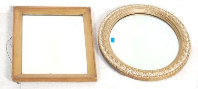 A Victorian 19th century gilt wood cushion mirror with inset plate mirror glass to gilded wooden