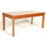 A good retro vintage 20th century teak wood coffee occasional long john table of Danish influence.