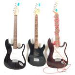 A collection of three vintage 90s electric guitars to include an Elevation Fender Stratocaster style