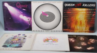 A group of six vinyl long play LP vinyl Record albums by Queen to include Queens first album (VG),