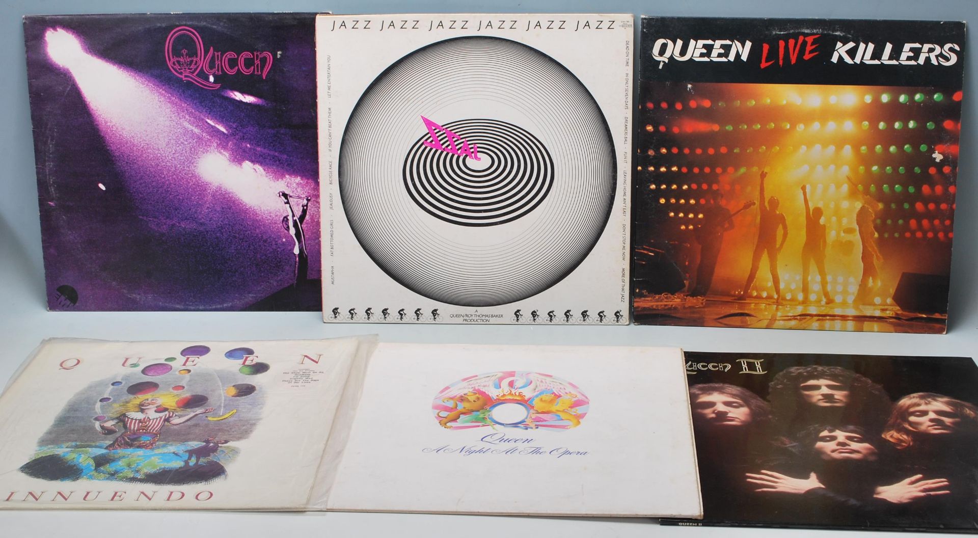 A group of six vinyl long play LP vinyl Record albums by Queen to include Queens first album (VG),