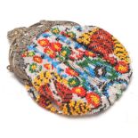 A vintage early 20th Century beaded ladies purse having a coloured bead floral design with a