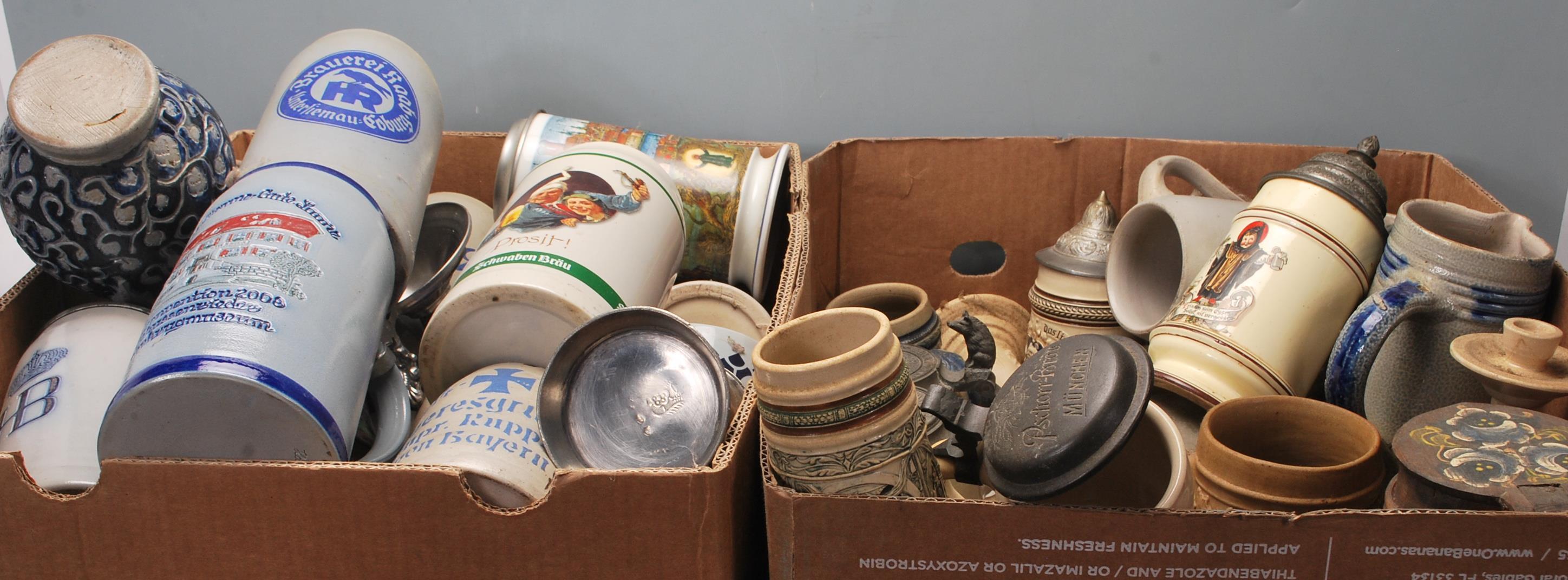 A large collection of German blue and grey stoneware jugs and beer steins, some having pewter - Image 7 of 10