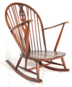 Lucian Ercolani for  Ercol Furniture. A beech and elm wood  rocking chair - armchair.  Model