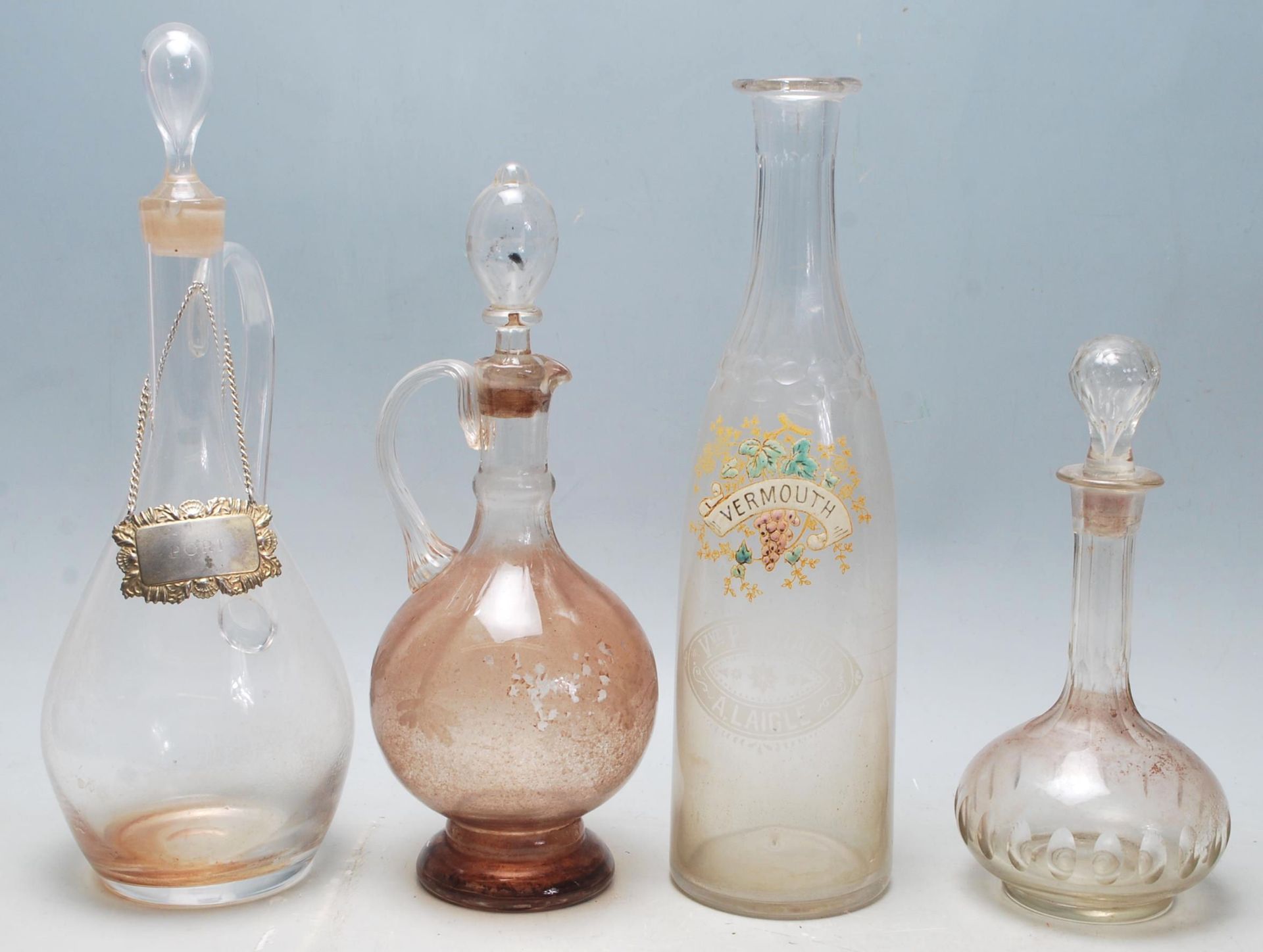 A collection of 18th century and 19th century Victorian glass decanters to include a two jug