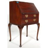 A 20th Century, circa 1940's antique ladies mahogany writing bureau desk having a fall front desk