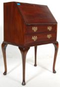 A 20th Century, circa 1940's antique ladies mahogany writing bureau desk having a fall front desk