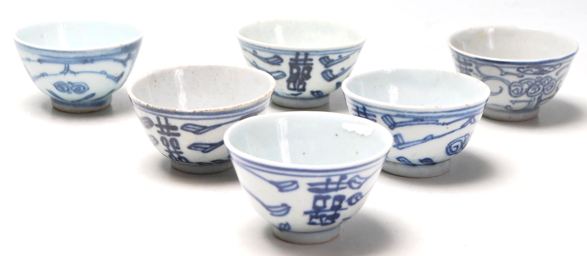 A set of six 19th and 20th century Chinese blue and white tea bowls having hand painted decoration
