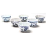 A set of six 19th and 20th century Chinese blue and white tea bowls having hand painted decoration