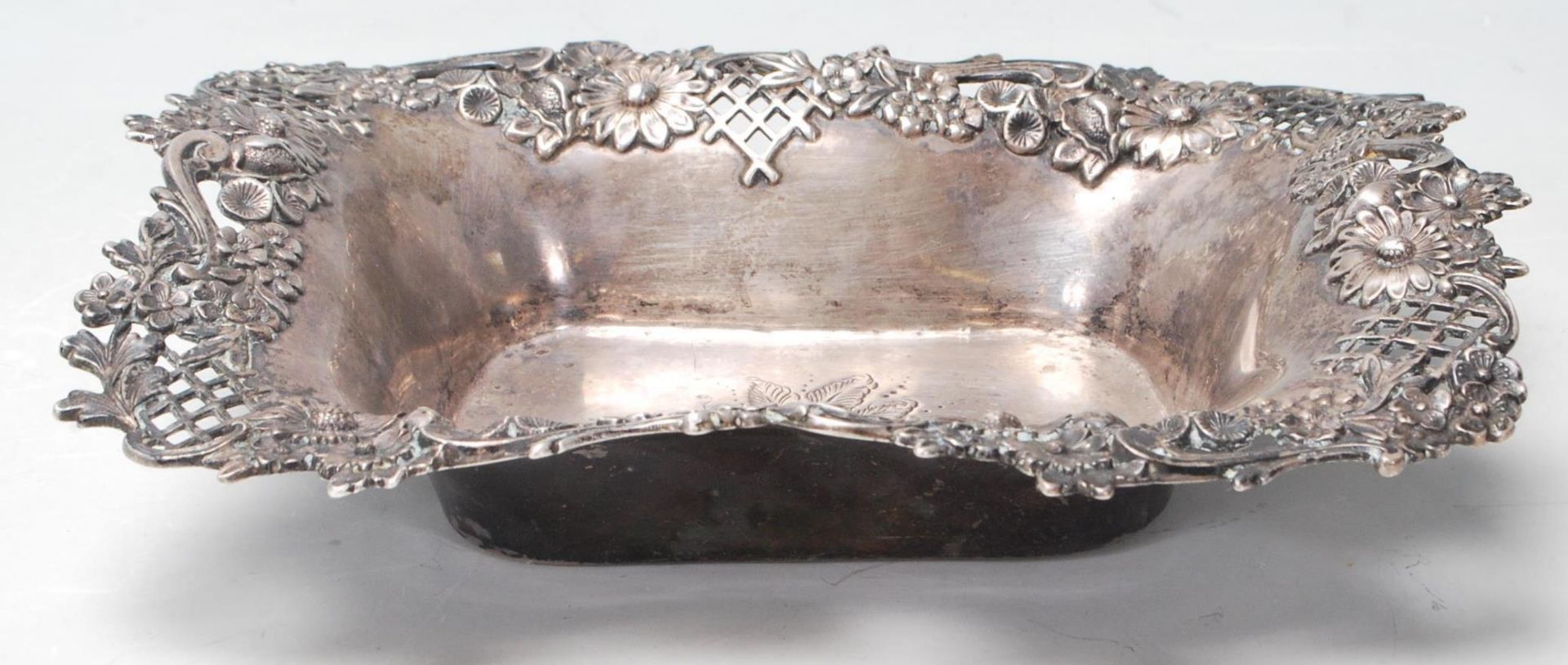 A good early 20th century sterling silver dish by Theodore B. Starr with raised floral decoration to