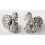 A pair of 20th Century silver plated salt and pepper condiments in the form of swans, each having