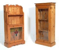 A Victorian style contemporary country pine and stained leaded glass bookcase cabinet being raised