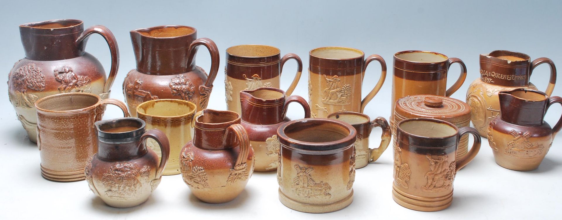 A collection of 19th Century Victorian ceramic Harvest ware jugs / drinking vessels / flagons,