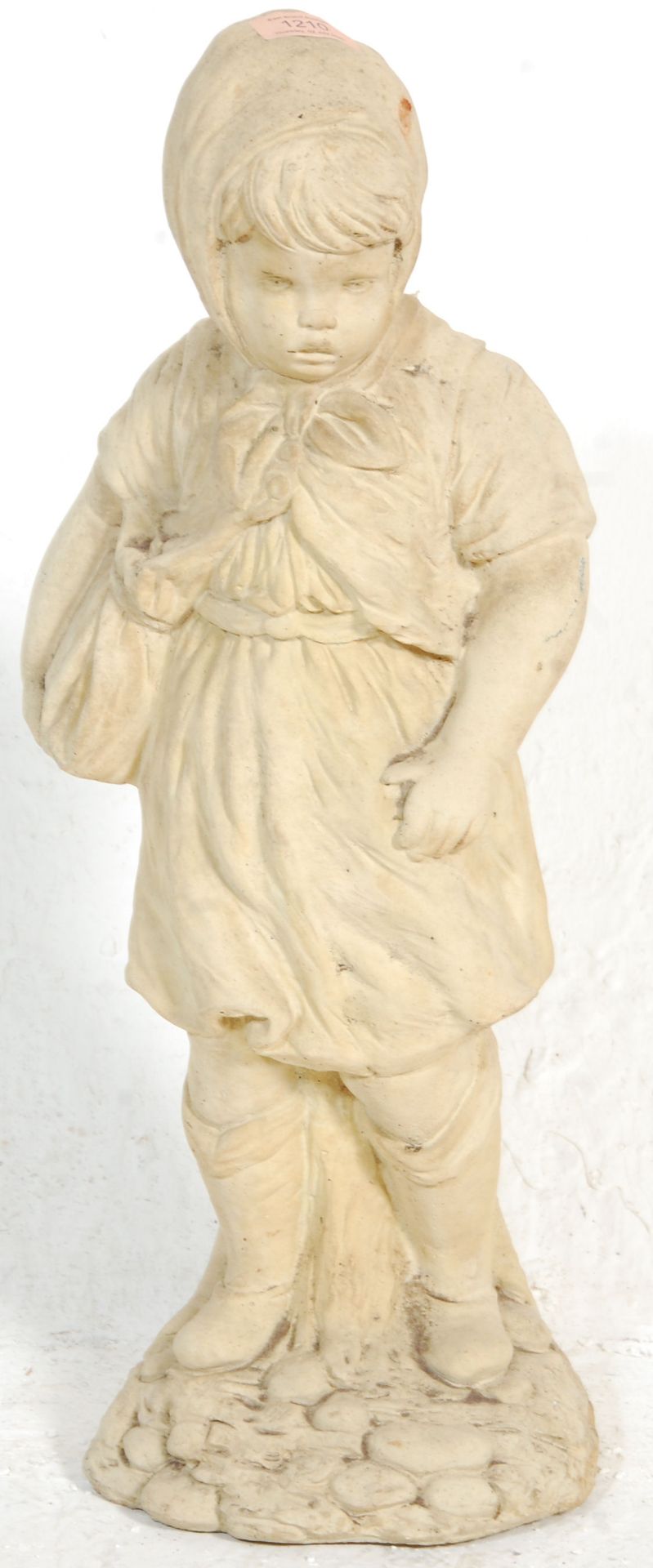 A composite stone garden figure / statue depicting