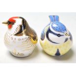 A pair of Royal Crown Derby paperweights both in the shape of birds to include Garden Blue Tit and a