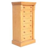 A 19th Century Victorian light oak Wellington chest of drawers. Raised on a plinth base with an