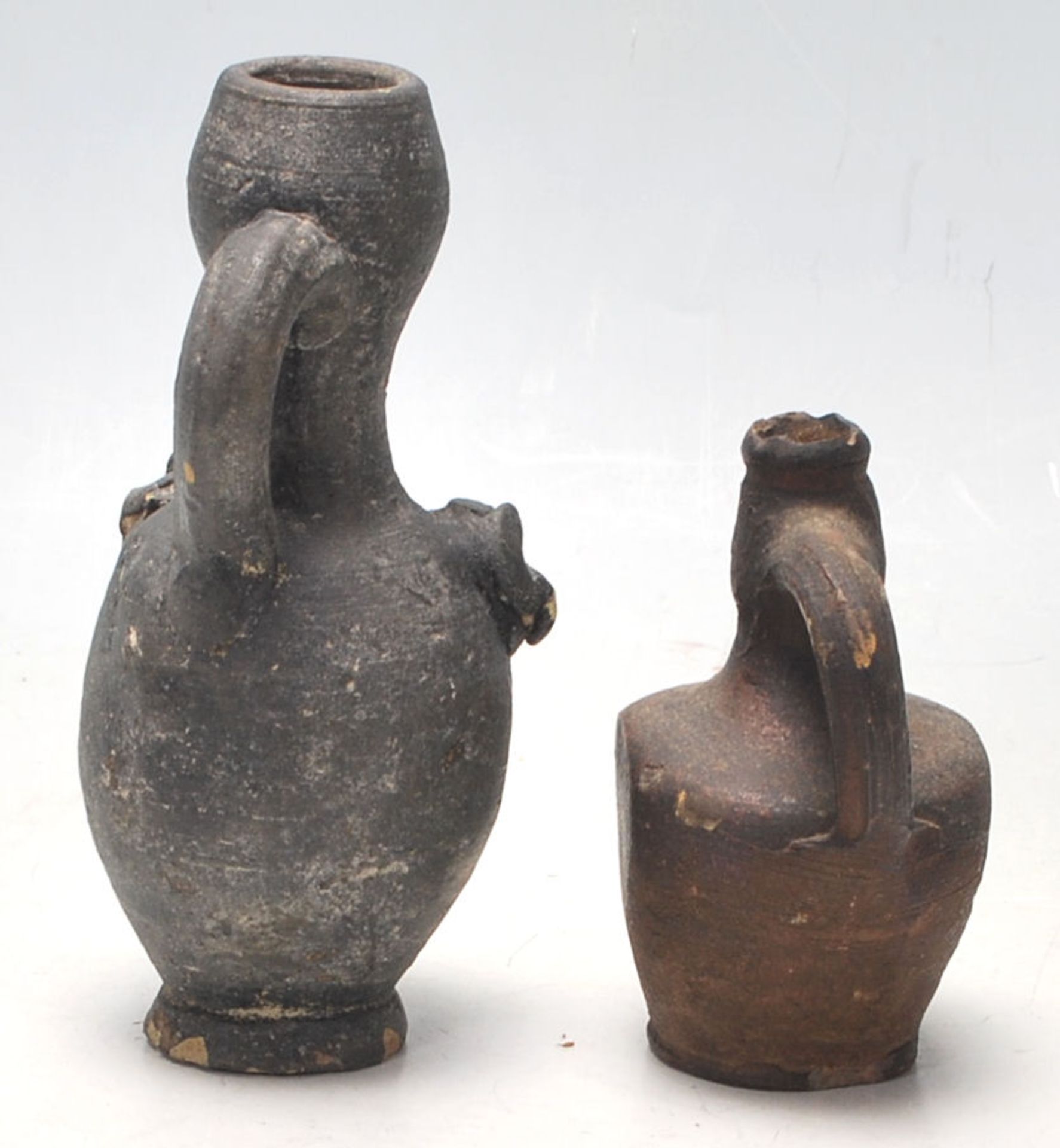 Two antique 16th Century style stoneware hand modelled jugs to to include an oil jug with applied - Bild 4 aus 7