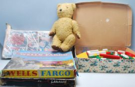 A collection of vintage toys to include a vintage teddy bear, a vintage Lego system set, loose lego,