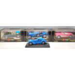 A collection of 4 BBurago diecast classic toy cars to include a Chevrolet Corvette 1957, Bugatti