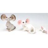 A group of 1960’s vintage German ceramic mice comprising of a pair of white and pink mice sitting on