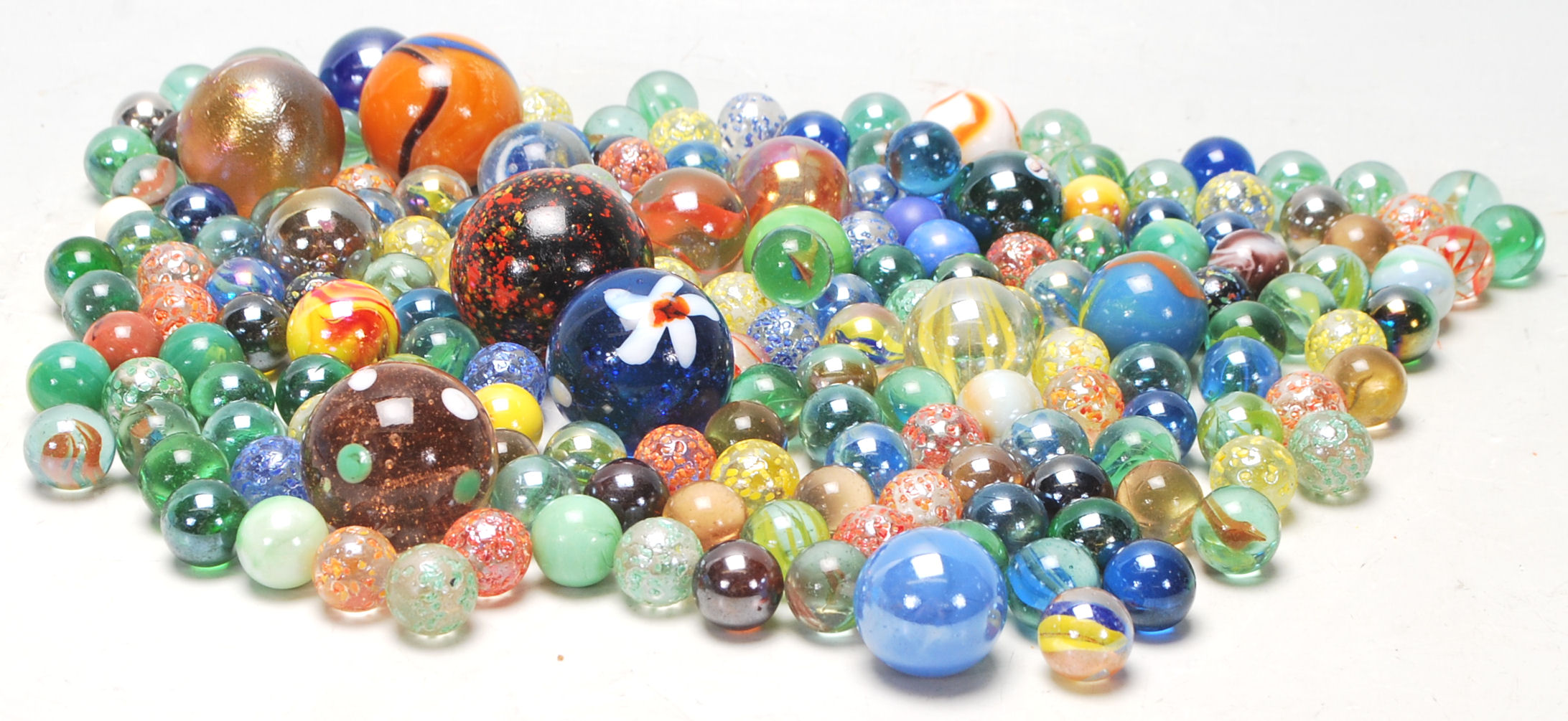 A collection of 20th Century glass marbles to include a wide selection of colours and styles to