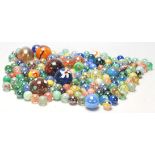 A collection of 20th Century glass marbles to include a wide selection of colours and styles to