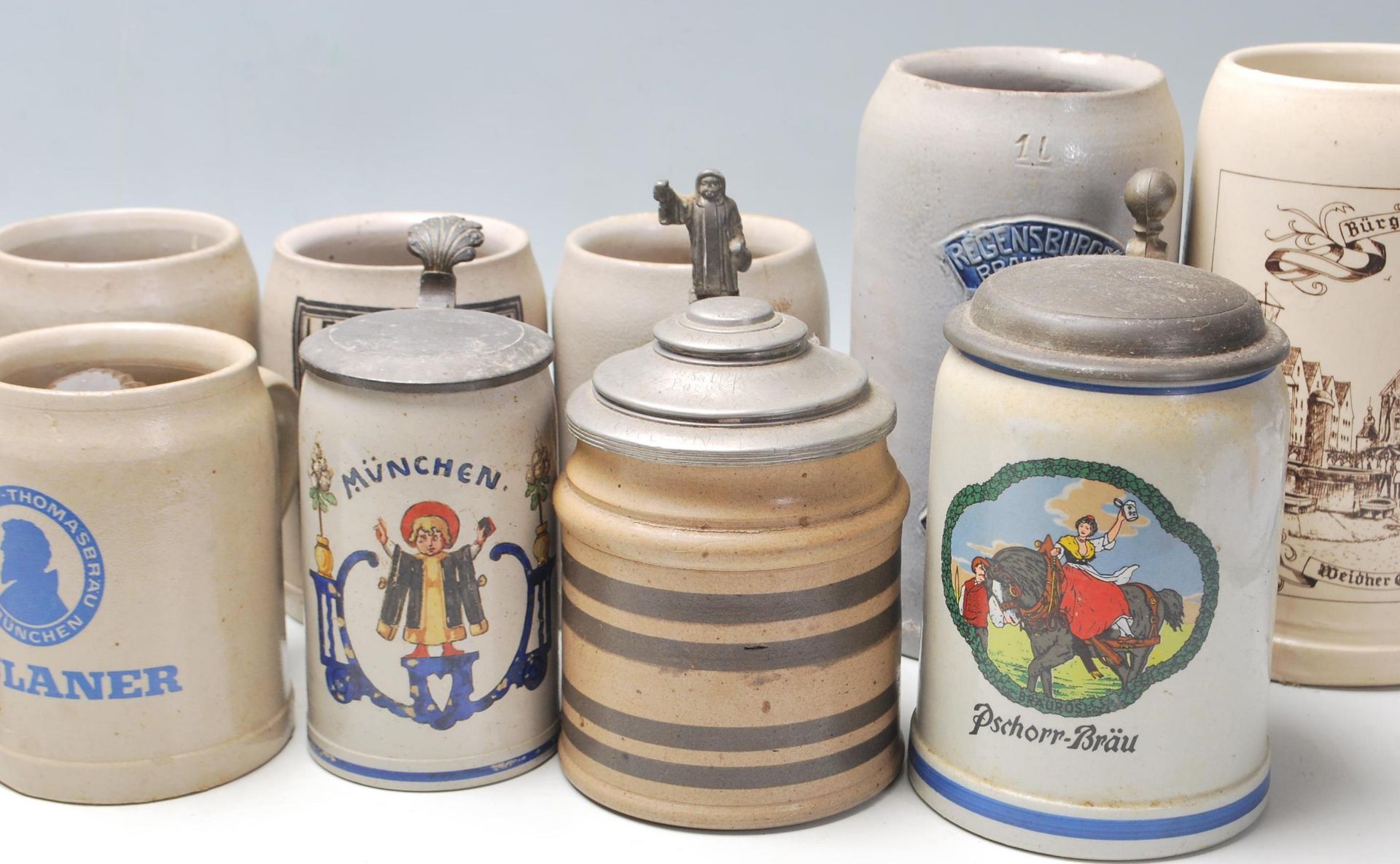 A large collection of 20th Century German blue and grey stoneware jugs and beer steins all having - Image 5 of 7