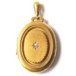A 19th Century Victorian 9ct gold and diamond locket of oval form having a central panel set with an
