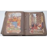 A 19th century Victorian postcard album filled with greetings cards, artist-type cards, views of