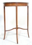 An Edwardian mahogany hall side table having an oval top with a diamond veneer and satinwood